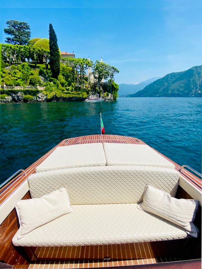 View from a luxury boat approaching Villa del Balbianello on Lake Como, Italy
