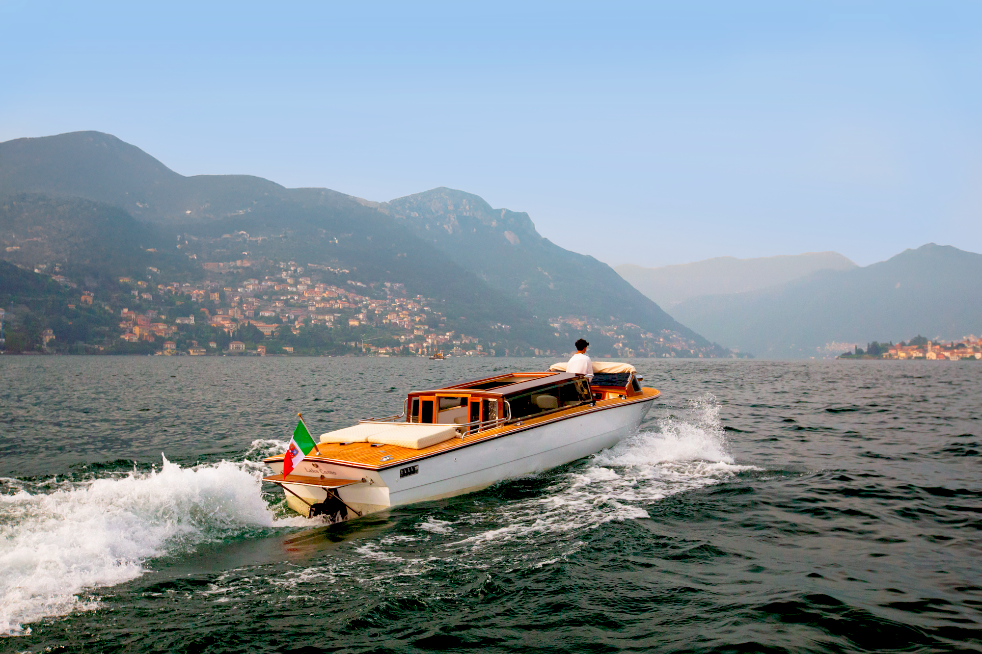 Luxury wooden boat on Lake Como offering private and exclusive tours in Italy